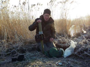 Richard Woolnough setting up a camerqa trap to observe otters